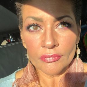 56 years old here.Using my products for about 18 years.TWO -2 FULL OUNCE BOTTLES